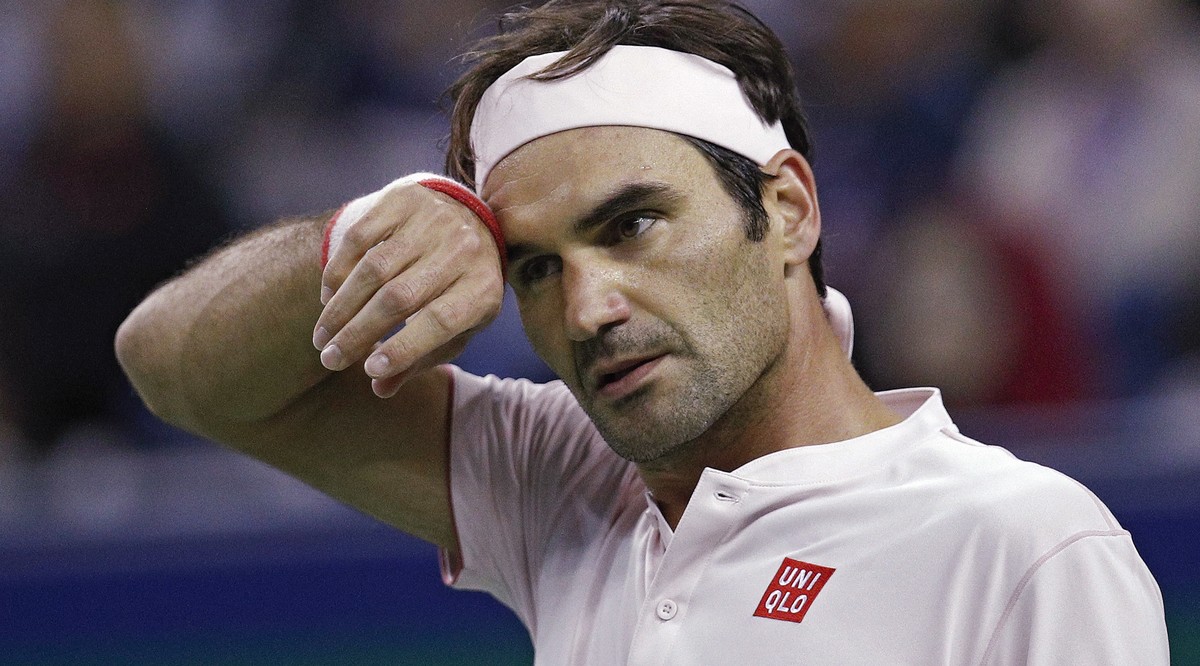 Roger Federer of Switzerland reacts during his during his men's singles quarterfinals match against Kei Nishikori of Japan in the Shanghai Masters tennis tournament at Qizhong Forest Sports City  ...