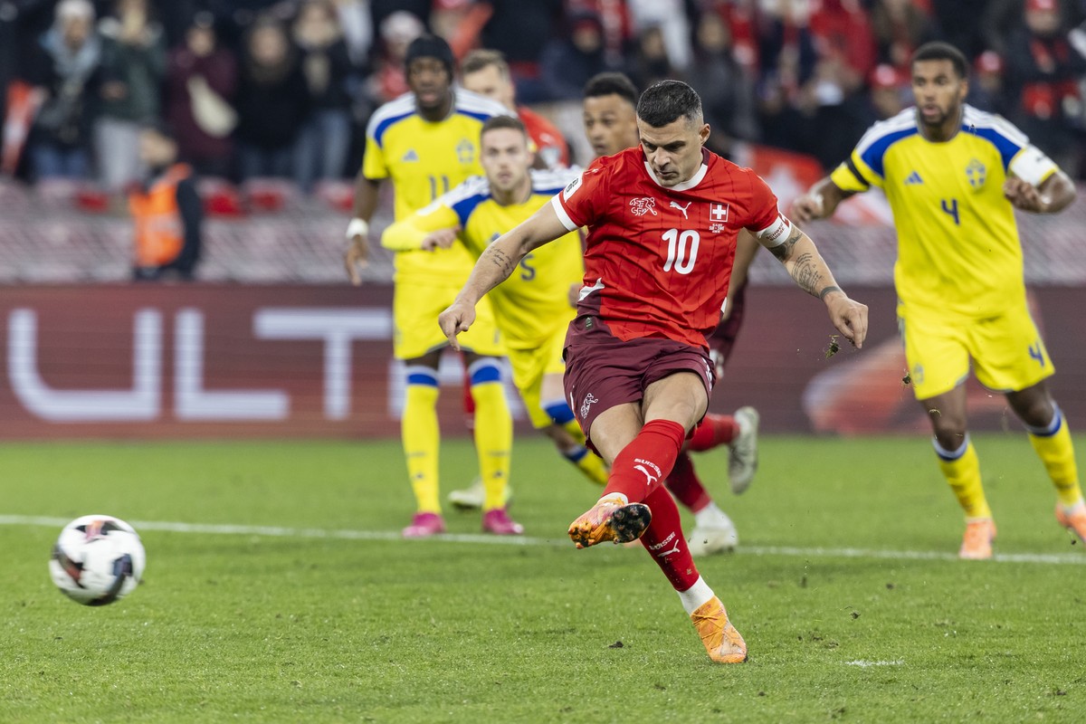 epa12528584 Switzerland's Granit Xhaka scores the 2-1 goal during the FIFA 2026 World Cup Group B qualifying soccer match between Switzerland and Sweden, in Geneva, Switzerland, 15 November 2025. ...