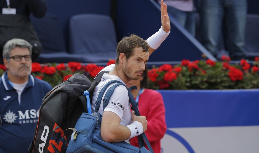 Andy Murray of Britain waves as he leaves the court after losing to Dominic Thiem of Austria in a semifinal match at the Barcelona Open Tennis Tournament in Barcelona, Spain, Saturday, April 29, 2017. ...