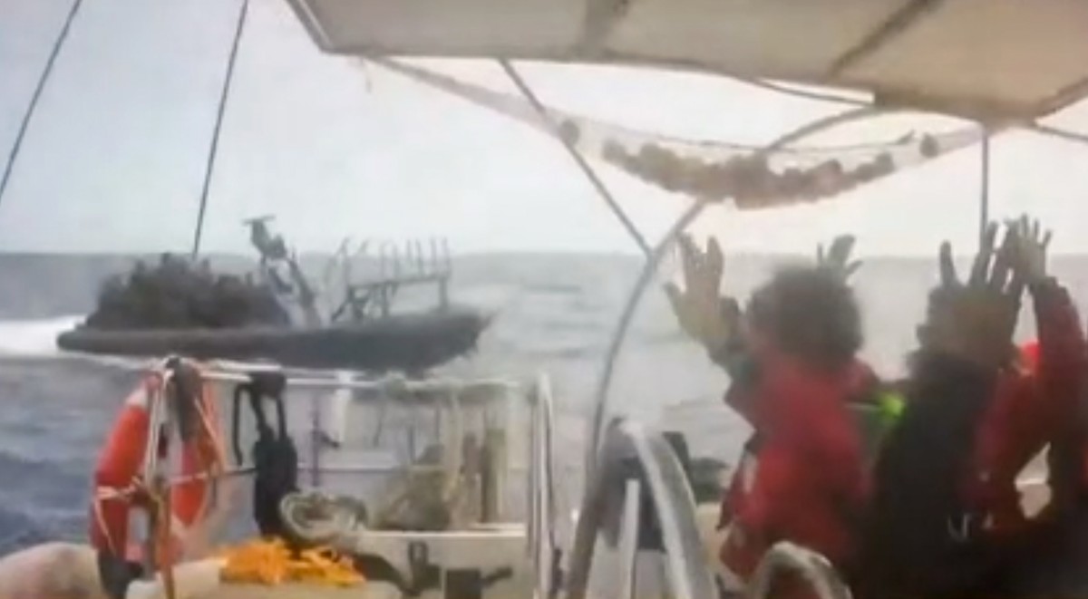 This grab from CCTV footage shows activists aboard a flotilla boat with their hands in the air as a boat approaches one of more than 50 vessels that departed from the port of Marmaris, Turkey, last we ...