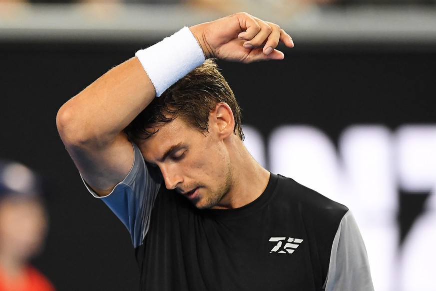 epa07289095 Henri Laaksonen of Switzerland reacts during his men&#039;s second round match against Alex de Minaur of Australia at the Australian Open tennis tournament in Melbourne, Australia, 16 Janu ...