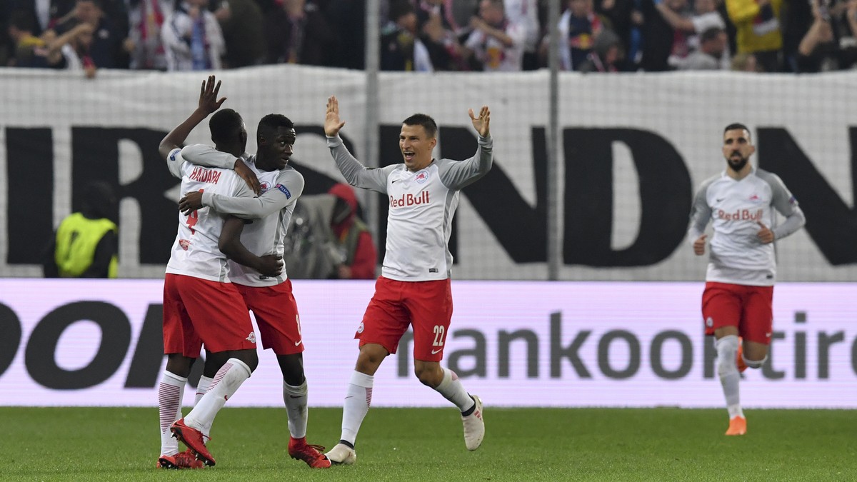 Salzburg's Amadou Haidara, second left, celebrates with his teammates after scoring his side's opening goal during the Europa League second leg semifinal soccer match between Salzburg and Ma ...