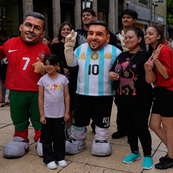 Mascots portraying soccer stars Cristiano Ronaldo and Lionel Messi pose for a group photo with passersby in the city center in Mexico City, Tuesday, June 16, 2026. (AP Photo/Marco Ugarte)
Mexico WCup  ...