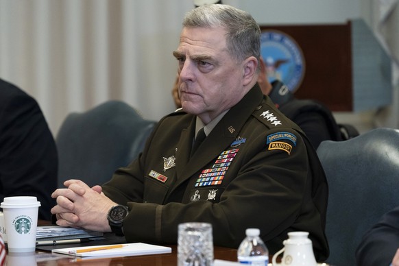 Joint Chiefs Chairman Gen. Mark Milley listens before a meeting with Secretary of Defense Mark Esper and Israeli Defense Minister Benny Gantz, at the Pentagon, Tuesday, Sept. 22, 2020, in Washington.  ...