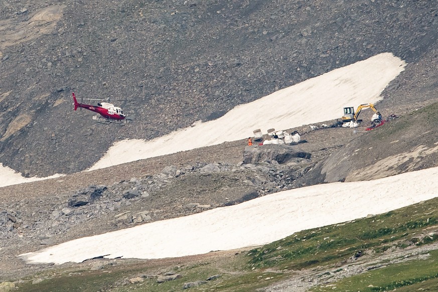 epa06930757 A helicopter flies over the site of the plane crash that happened 04 August afternoon near Flims, Switzerland, 06 August 2018. The plane, a historic three-engine Junkers Ju-52, crashed on  ...
