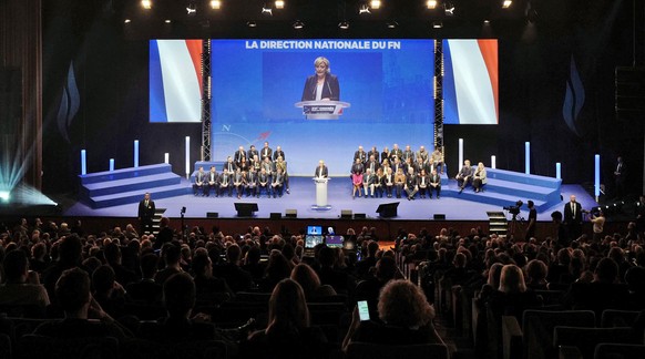 epa06595821 French member of the parliament and far-right political party National Front (Front National, FN) president Marine Le Pen (C, at rostrum) delivers a speech during the XVI party congress of ...