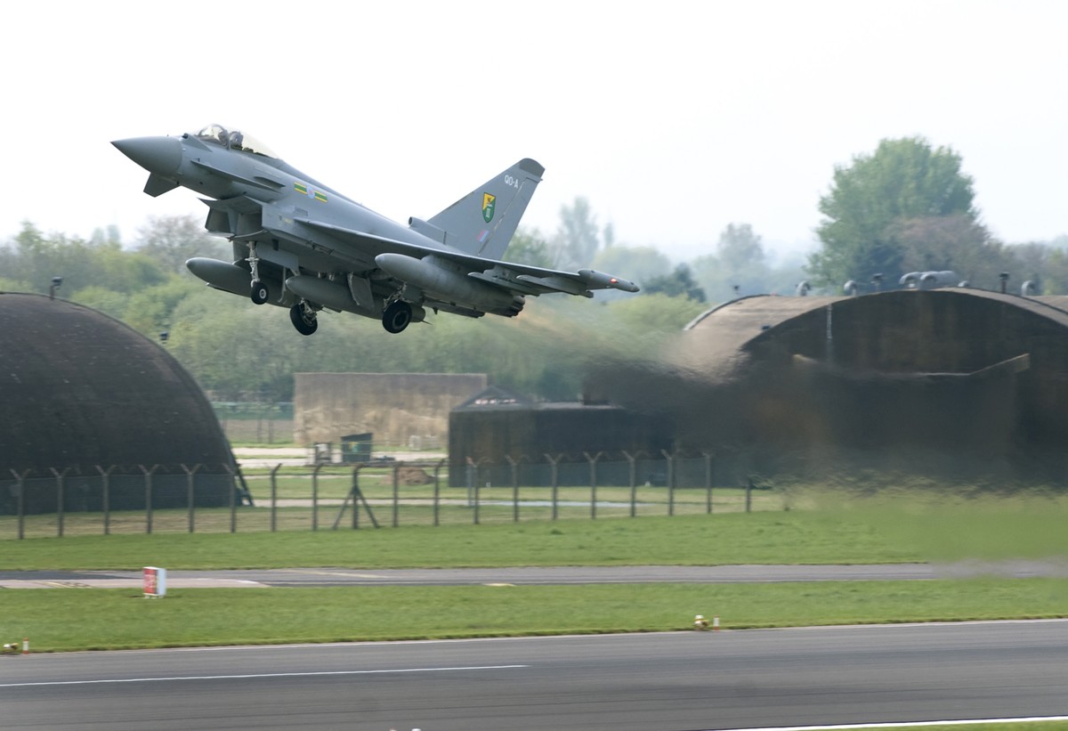 In this photo released by Britain's RAF, one of Britain's Royal Air Force Typhoon aircraft lifts off from an RAF base near Lincoln, England, Monday April 28, 2014, deployed to take part in t ...