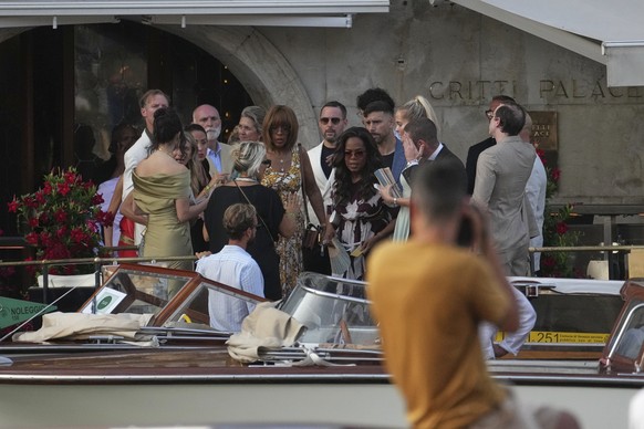 Oprah Winfrey, center right, and Gayle King, center left, leave a hotel for the pre wedding reception of Amazon founder Jeff Bezos and Lauren Sanchez, in Venice, Italy, Thursday, June 26, 2025. (AP Ph ...