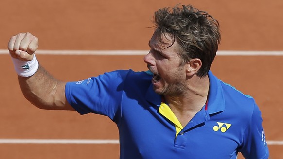 =Switzerland&#039;s Stan Wawrinka clenches his fist after scoring a point against France&#039;s Gael Monfils during their fourth round match of the French Open tennis tournament at the Roland Garros s ...