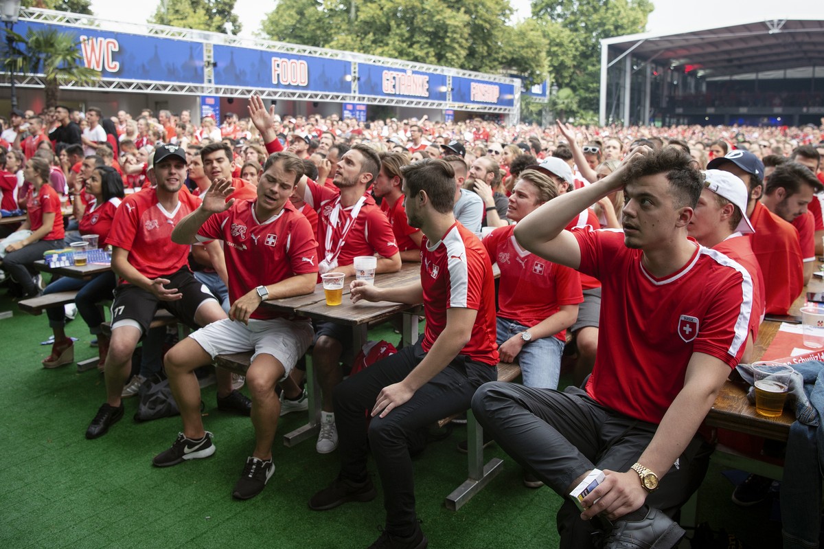 Swiss supporters react at a public viewing of the FIFA 2018 World Cup round of 16 soccer match between Switzerland and Sweden, in the fan zone "Winti Arena" in Winterthur, Switzerland, Tuesd ...