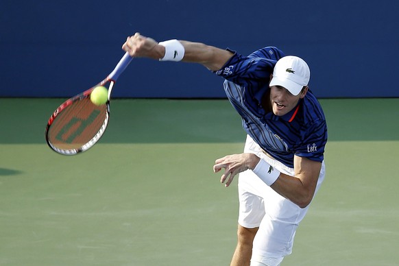 Sep 3, 2015; New York, NY, USA; John Isner of the United States serves against Mikhail Youzhny of Russia (not pictured) on day four of the 2015 U.S. Open tennis tournament at USTA Billie Jean King Nat ...