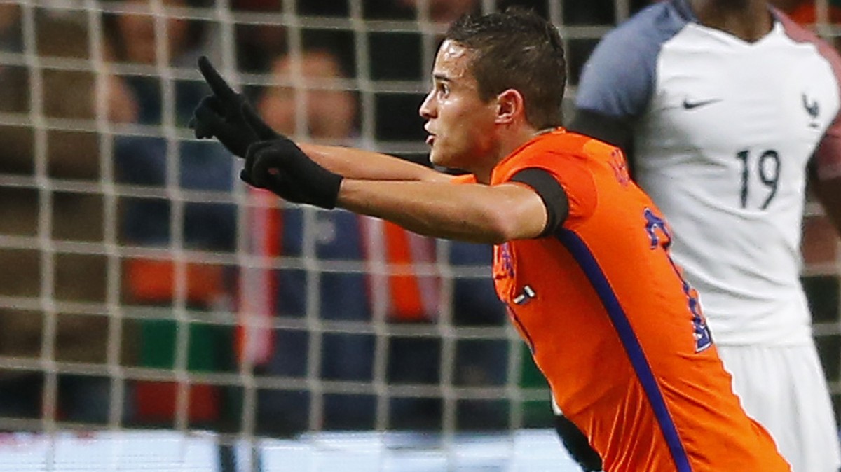 Netherlands Ibrahim Affelay, right in orange, celebrates after scoring his side's second goal during a international friendly soccer match between The Netherlands and France at the ArenA stadium ...