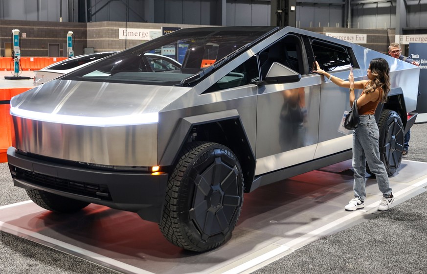 epa11138406 A Tesla 2025 Cybertruck is on display at the 2024 Chicago Auto Show in Chicago, Illinois, USA, 08 February 2024. The annual showcase for automotive manufacturers is the largest auto show i ...