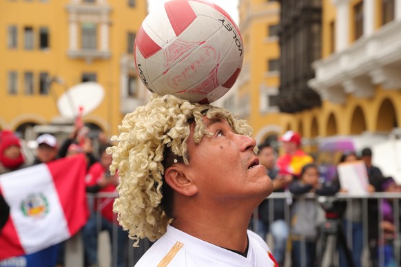 epa06827909 Peruvian fans meet to watch the game of their team against France, from the Plaza de Armas of Lima, Peru, 21 June 2018. EPA/Ernesto Arias