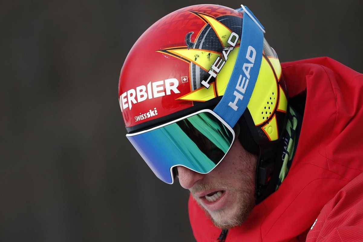 Switzerland's Justin Murisier inspects the course during a men's giant slalom, at the alpine ski World Championships, in Cortina d'Ampezzo, Italy, Friday, Feb. 19, 2021. (AP Photo/Gabri ...