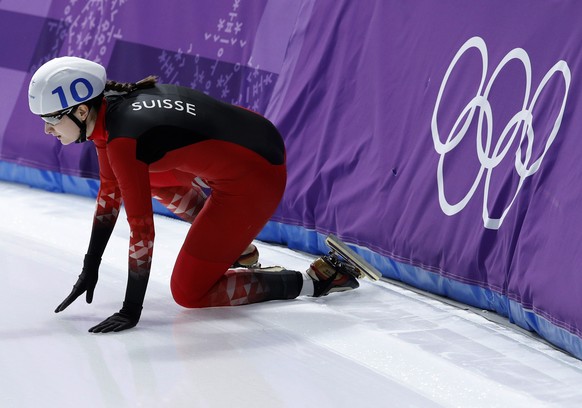 Ramona Haerdi of Switzerland gets up after crashing during the women's mass start semifinal speedskating race at the Gangneung Oval at the 2018 Winter Olympics in Gangneung, South Korea, Saturday, Feb. 24, 2018. (AP Photo/Vadim Ghirda)