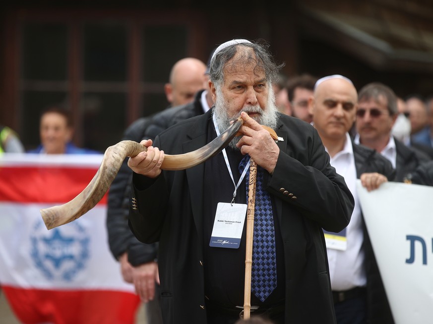 epa09914158 Rabbi Yochanan Fried takes part in the &#039;March of the Living&#039; at the former Nazi concentration death camp Auschwitz in Oswiecim, Poland, 28 April 2022. The annual Holocaust-commem ...