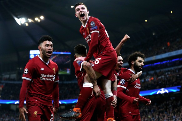 epa06660262 Liverpool&#039;s Mohamed Salah (R) celebrates with his teammates after scoring the 1-1 equalizer during the UEFA Champions League quarter final second leg match between Manchester City and ...