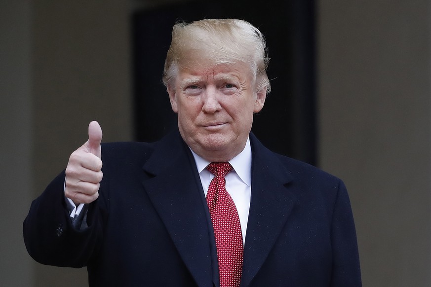 epa07154850 US President Donald J. Trump gestures upon his arrival at the Elysee Palace for his meeting with French President Emmanuel Macron (not pictured) in Paris, France, 10 November 2018. US Pres ...