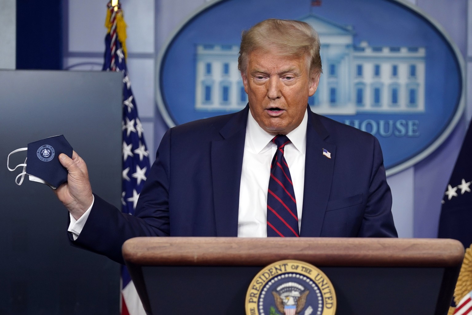 President Donald Trump holds a face mask as he speaks during a news conference at the White House, Tuesday, July 21, 2020, in Washington. (AP Photo/Evan Vucci)
Donald Trump