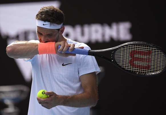 Bulgaria&#039;s Grigor Dimitrov prepares to serve to Russia&#039;s Aslan Karatsev during their quarterfinal match at the Australian Open tennis championship in Melbourne, Australia, Tuesday, Feb. 16,  ...