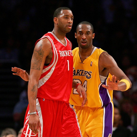 LOS ANGELES, CA - MARCH 30: Kobe Bryant #24 of the Los Angeles Lakers battles for position against Tracy McGrady #1 of the Houston Rockets at Staples Center on March 30, 2007 in Los Angeles, Californi ...