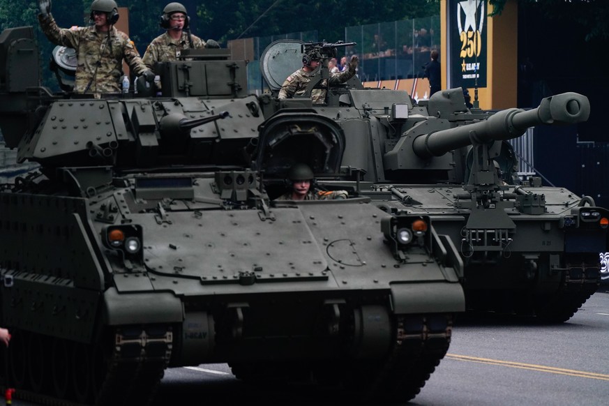 epa12176218 Members of the military in tanks during the US Army's 250th Anniversary Parade in Washington, DC, USA, 14 June 2025. The parade, which happens to coincide with US President Donald Tru ...