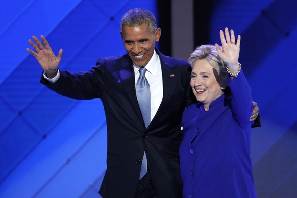 FILE - In this July 27, 2016 file photo, President Barack Obama and Democratic presidential nominee Hillary Clinton wave to delegates after President Obama&#039;s speech during the third day of the De ...