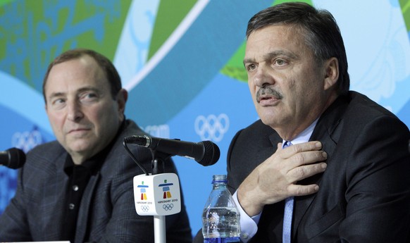 FILE - In this Feb. 18, 2010, file photo, Rene Fasel, International Ice Hockey Federation President, right, and Gary Bettman, National Hockey League Commissioner, are seen during a press conference at ...