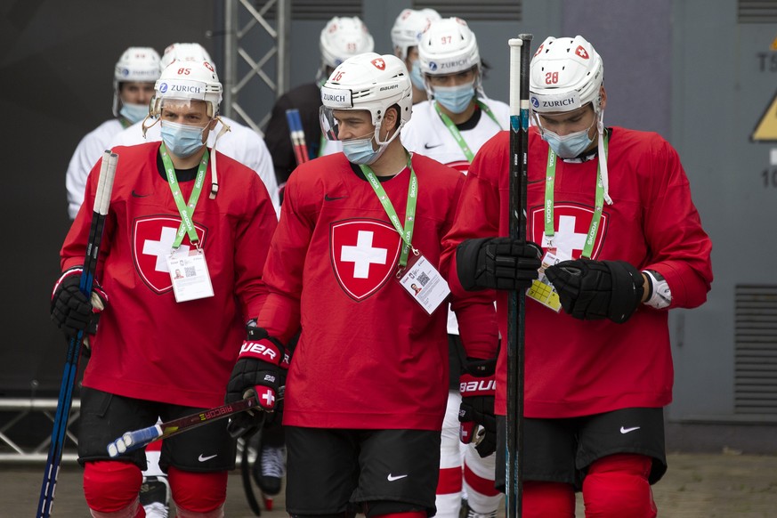 Switzerland&#039;s players forward Sven Andrighetto #85, defender Raphael Diaz, #16, and forward Timo Meier #28, leave with their teammates the Olympic Sports Center for going to training session one  ...