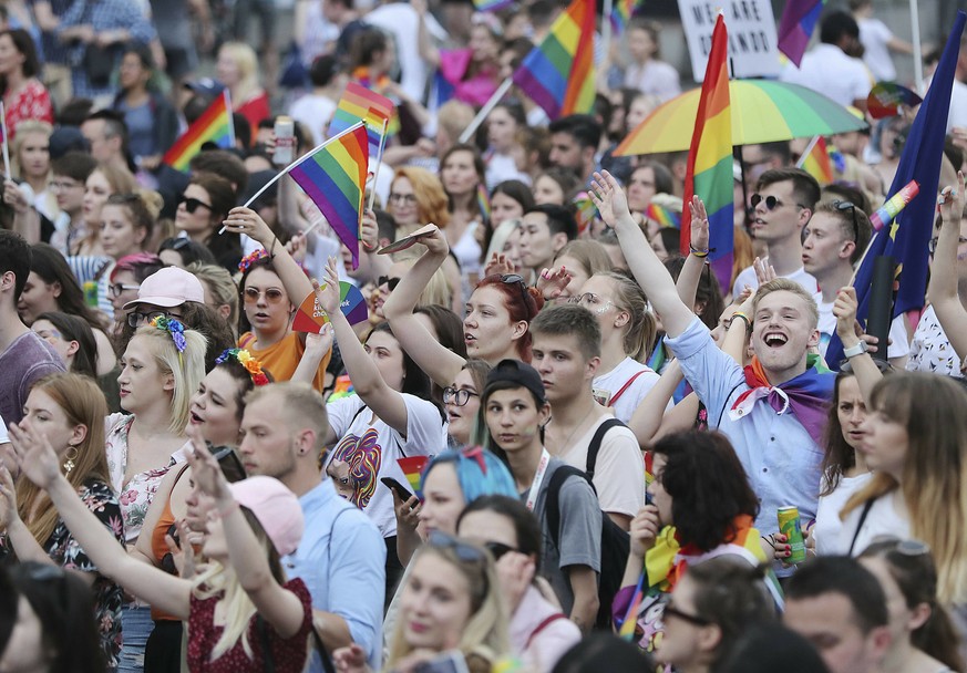 People take part in a gay pride parade in Warsaw, Poland, on Saturday, June 8, 2019. The Equality Parade is the largest gay pride parade in central and Eastern Europe. It brought thousands of people t ...