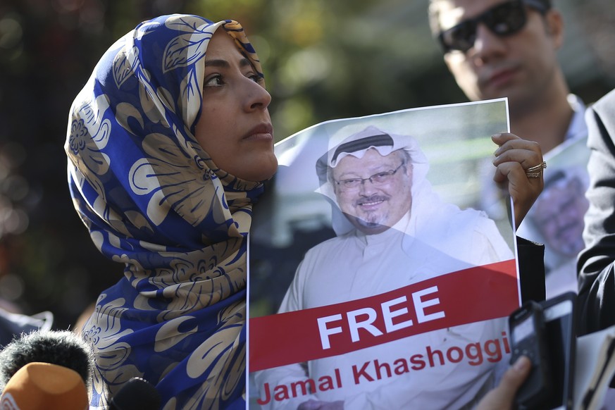 FILE - In this Friday, Oct. 5, 2018 file photo, Tawakkol Karman, the Nobel Peace Prize laureate for 2011 holds a picture of missing Saudi writer Jamal Khashoggi as she speaks to journalists near the S ...