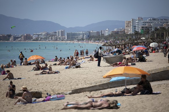 Tourists enjoy the beach at the Spanish Balearic Island of Mallorca, Spain, Monday, June 7, 2021. Spain is jumpstarting its summer tourism season by welcoming vaccinated visitors from most countries a ...