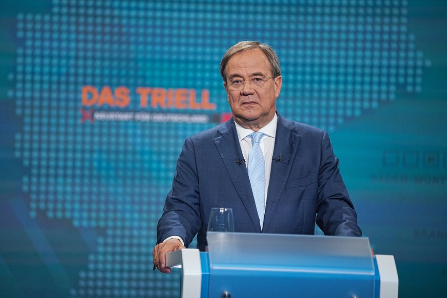 epa09436032 The chancellor candidate of CDU Armin Laschet during a first TV discussion on RTL and ntv in Berlin, Germany, 29 August 2021. Germany elects a new parliament on 26 September 2021. EPA/MICH ...