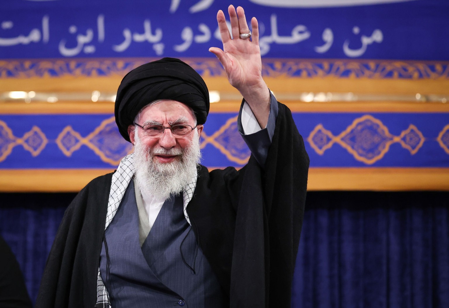 epa12622672 A handout picture made available by Iran's Supreme Leader Office shows Ayatollah Ali Khamenei greeting a crowd during a ceremony in Tehran, Iran, 03 January 2026. Khamenei commented o ...