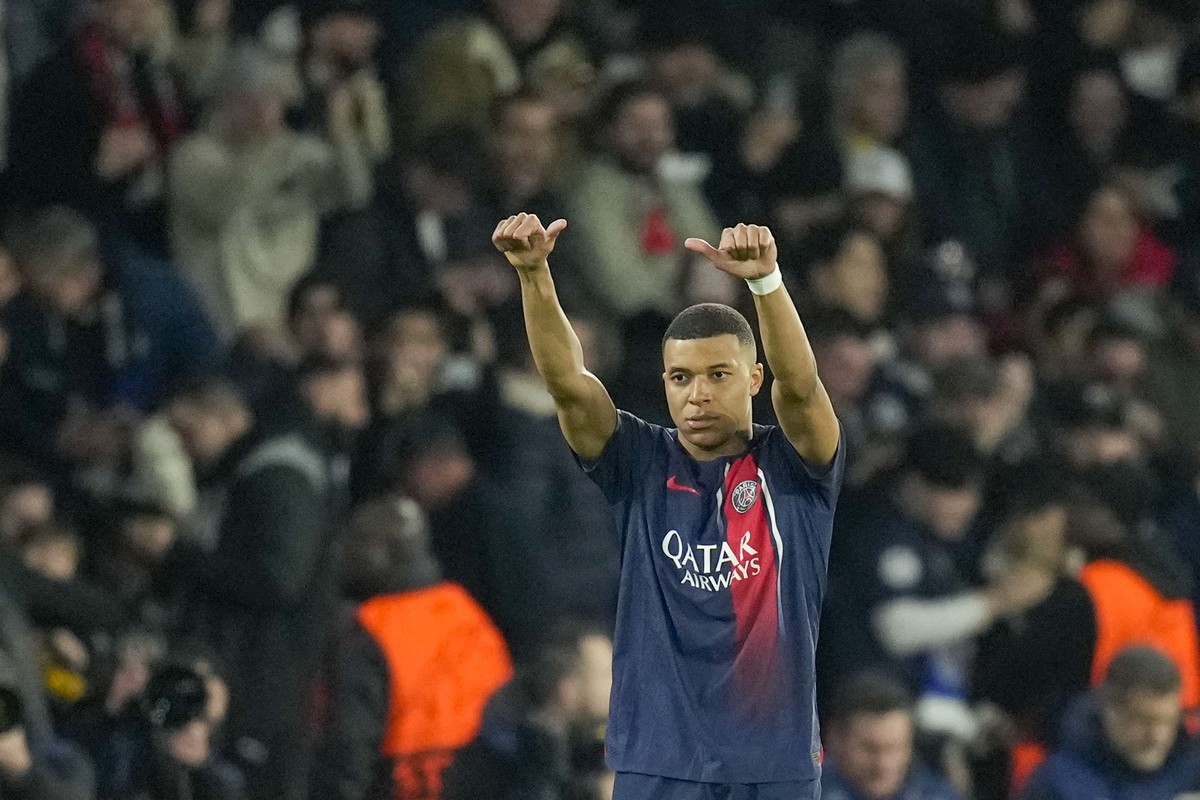 PSG's Kylian Mbappe celebrates after scoring his side's opening goal during the Champions League round of 16 first leg soccer match between Paris Saint-Germain and Real Sociedad, at the Parc ...