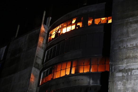 epa09332550 The Hashem Foods Limited factory on fire at Narayanganj district, on the outskirts of Dhaka, Bangladesh, 08 July 2021. According to the Ruoganj Fire Service, at least three people died and ...