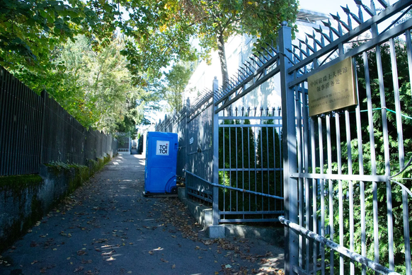 Bomontiweg from below.  The mobile toilet for security guards was installed by the Chinese after neighbors intervened.  The guards who are not allowed on the embassy grounds...