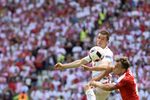 PolandÃs midfielder Krzysztof Maczynski, left, fights for the ball with Swiss forward Xherdan Shaqiri, right, during the UEFA EURO 2016 round of 16 soccer match between Switzerland and Poland, at the ...