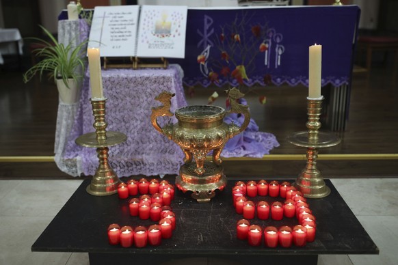 Candles are arranged in a &quot;39&quot; during a Mass and vigil for the 39 victims found dead inside the back of a truck in Grays, Essex, at The Holy Name and Our Lady of the Sacred Heart Church, eas ...