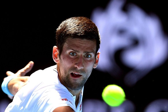 epa05729396 Novak Djokovic of Serbia in action against Denis Istomin of Uzbekistan during their Men&#039;s Singles second round match at the Australian Open Grand Slam tennis tournament in Melbourne,  ...