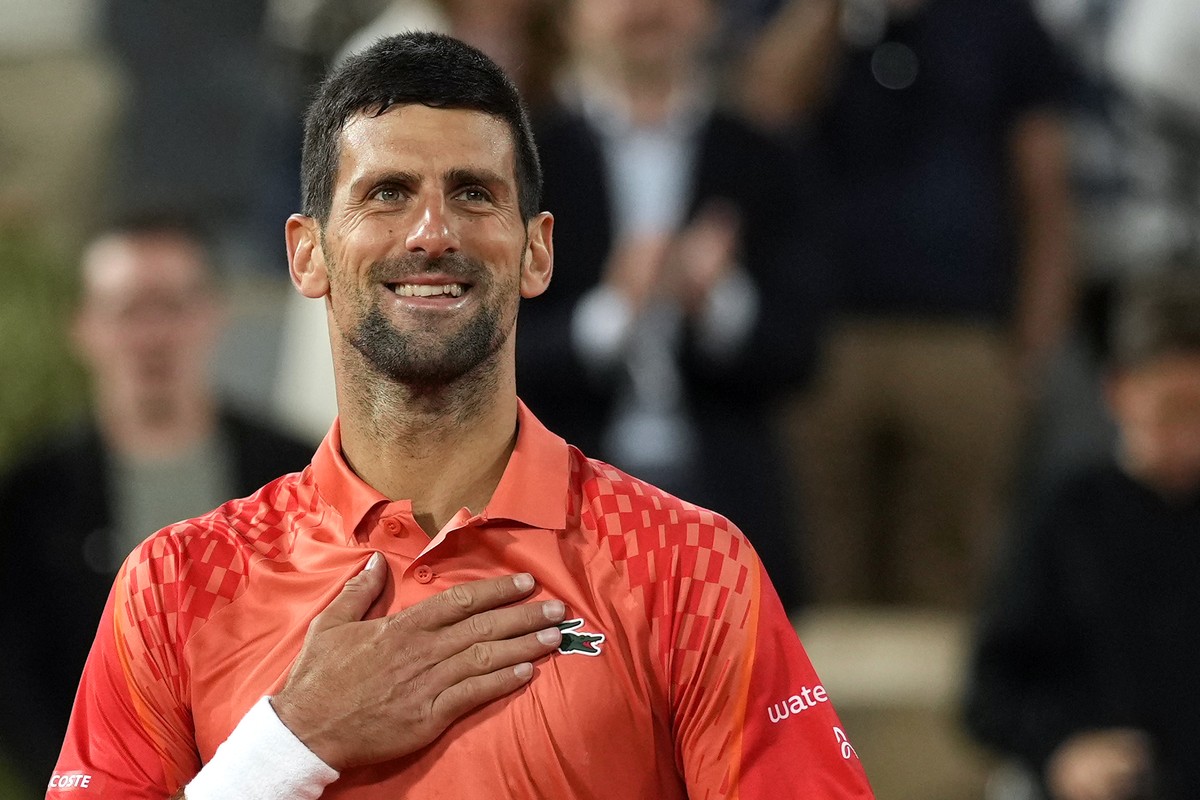 Serbia's Novak Djokovic celebrates after beating Hungary's Marton Fucsovics during their second round match of the French Open tennis tournament at the Roland Garros stadium in Paris, Wednes ...