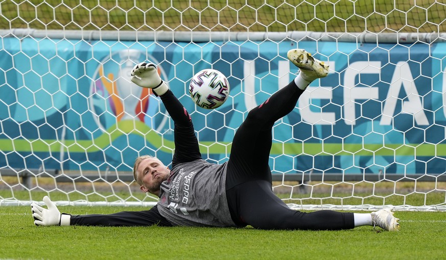 Denmark's goalkeeper Kasper Schmeichel exercises at the training ground during a training session of Denmark's national team in Helsingor, Denmark, Monday, June 14, 2021. It is the first training of t ...
