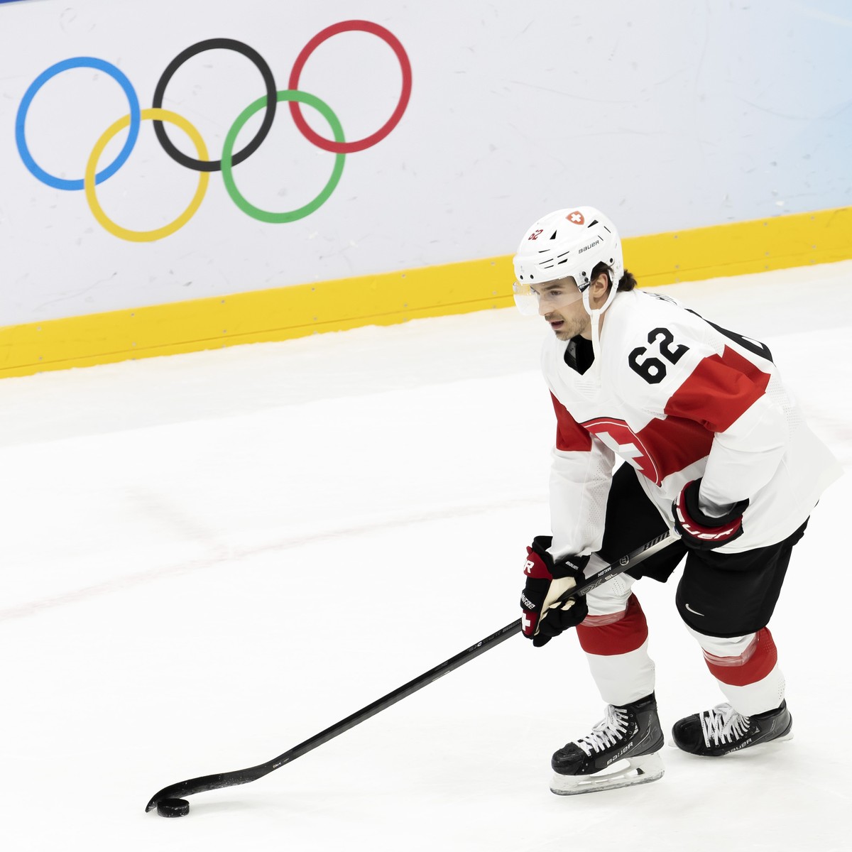 Switzerland's forward Denis Malgin controls the puck during the warm up prior the men's ice hockey preliminary round game between Czech Republic and Switzerland at the National Indoor Stadiu ...