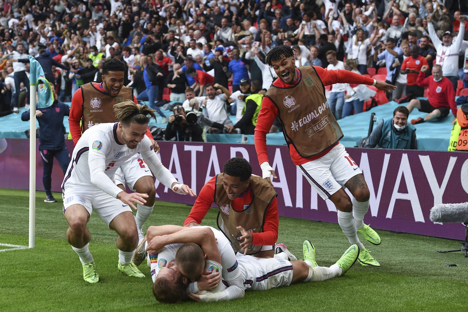 England&#039;s Harry Kane, bottom, is celebrated by teammates after scoring his side&#039;s 2nd goal the Euro 2020 soccer championship round of 16 match between England and Germany, at Wembley stadium ...
