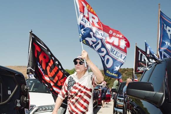 epa11479189 People gather for a rally in support of former US President Donald Trump in Simi Valley, California, USA, 14 July 2024. Trump was injured by a bullet in an assassination attempt on 13 July ...