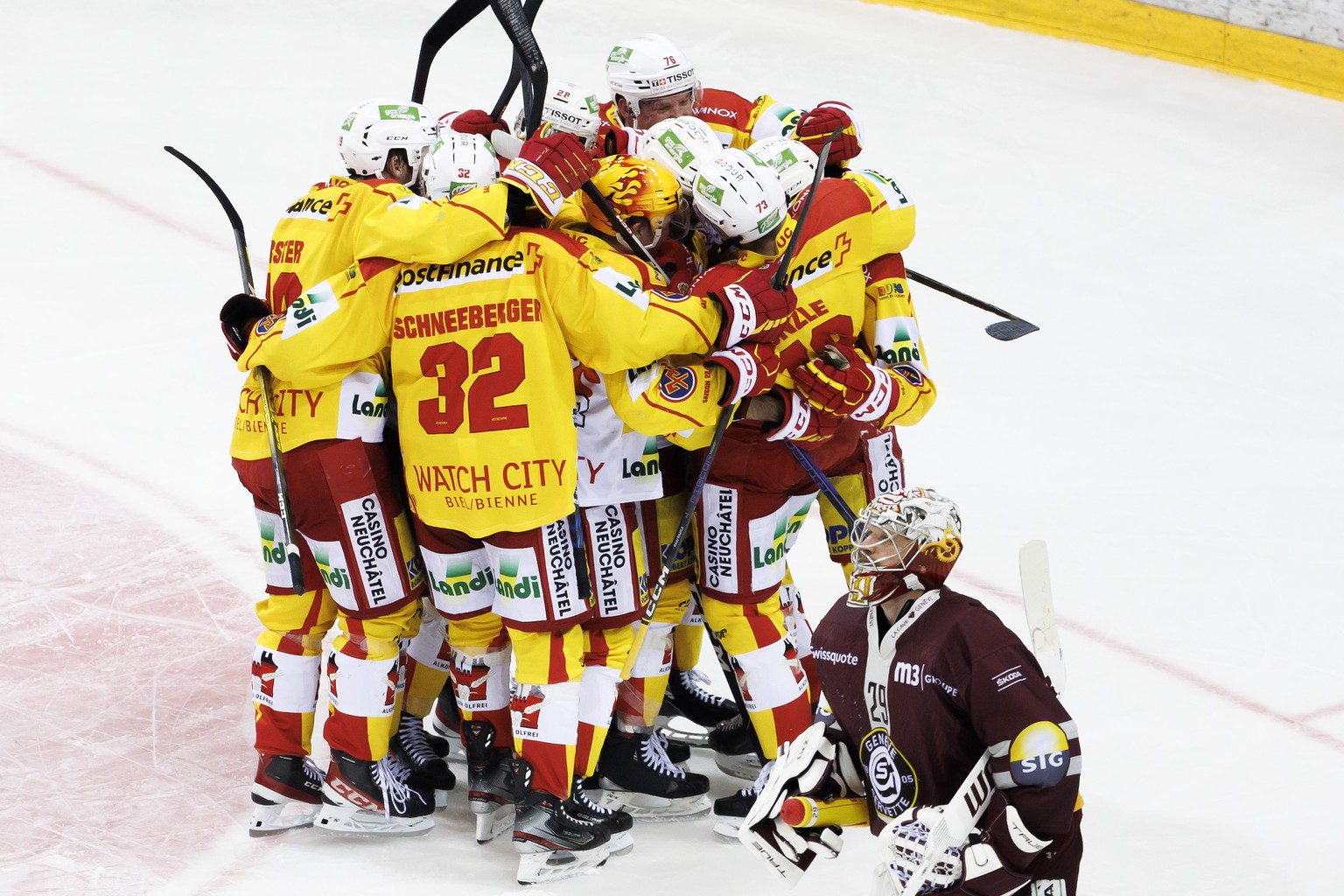 Biel&#039;s players celebrate after scoring the winner goal, during the overtime of the third leg of the National League Swiss Championship final playoff game between Geneve-Servette HC and EHC Biel-B ...