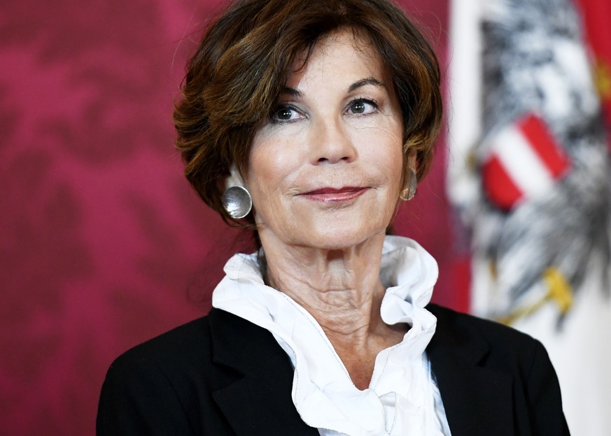 epa07612475 Brigitte Bierlein, president of the Austrian constitutional court, looks on during a press conference with Austrian President Alexander van der Bellen at the Hofburg Palace in Vienna, Aust ...