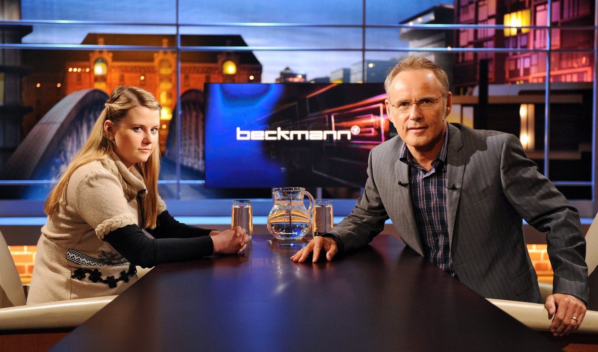 epa02317660 A picture dated 04 September 2010 shows Austrian Natascha Kampusch sitting in the television studio with German moderator Reinhold Beckmann prior to the recording of TV talkshow 'Beck ...