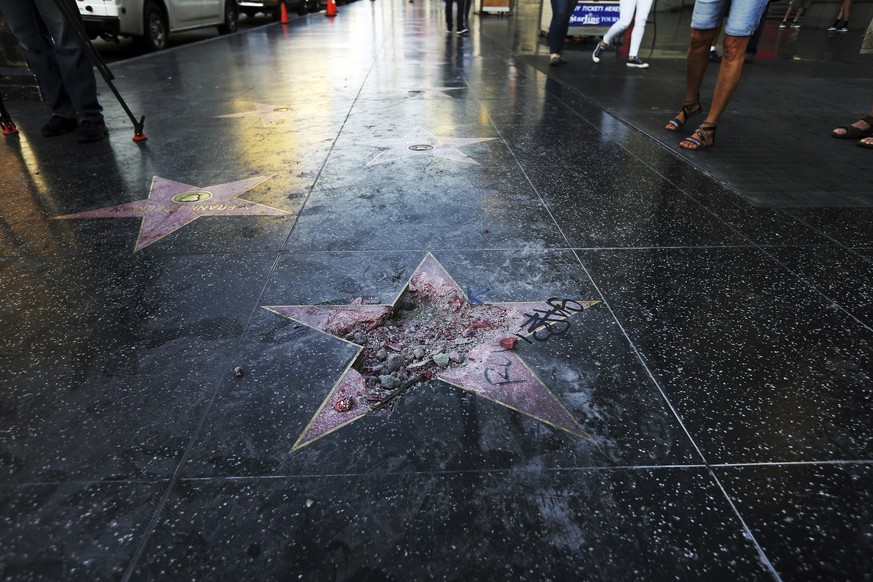 FILE - This Wednesday, July 25, 2018 file photo shows Donald Trump&#039;s vandalized star on the Hollywood Walk of Fame in Los Angeles. On Friday, Aug. 3, 2018, The Associated Press has found that sto ...